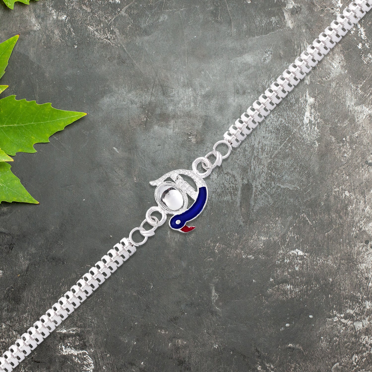 Elegant Peacock Design Rakhi With Blue Enamel And Silver Metal Chain Elegant Peacock Design Rakhi With Blue Enamel And Silver Metal Chain